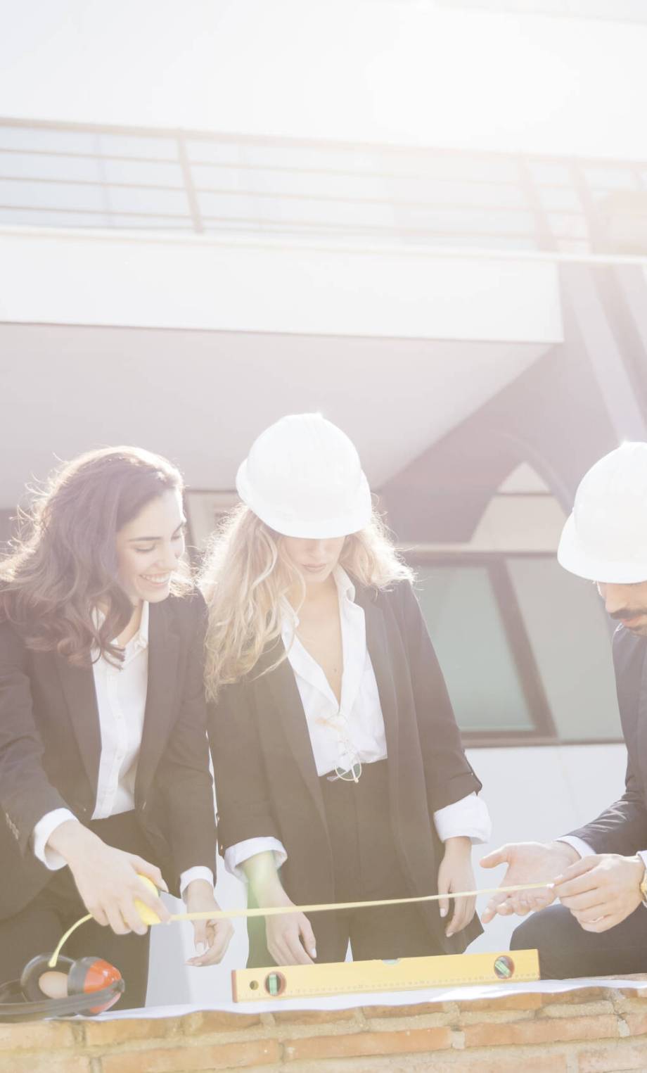 sun-shining-architects-wearing-helmets